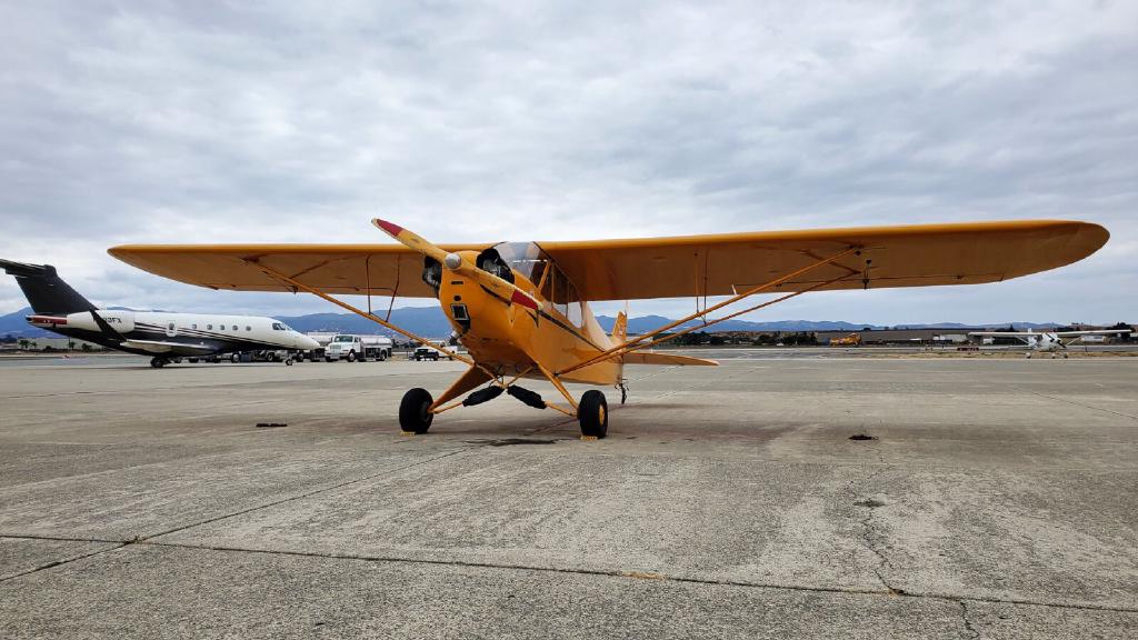 Yellow Restored Piper J3 Cub Sitting on The