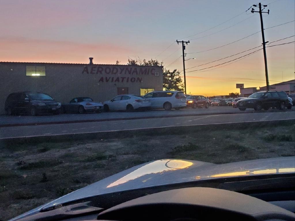 Sunset at the Airport by Aerodynamic Aviation Hangars