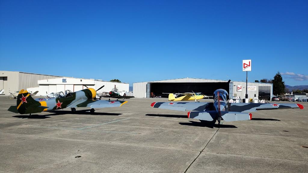 Three Yak 50 Aircraft and a Cessna 140